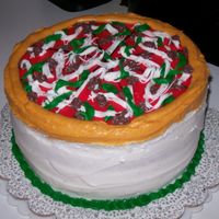 Pizza Cake Chocolate and vanilla cake with strawberry filling. Pizza toppings all butter cream