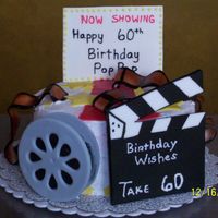 Movie Theme Cake A friend came up with this design and we did this cake for a Birthday of someone who was in the film business. The cake is vanilla iced...