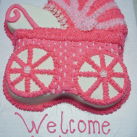 Baby Carriage Yellow cake with buttercream icing and fondant flowers.