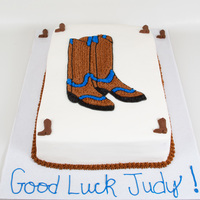 Cowboy Boots 15"x20" strawberry cake with sliced strawberries and homemade strawberry glaze filling with vanilla buttercream icing. Made for a...