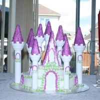 Princess Castle My first castle cake. I should have make the layers taller, I will know for next time. The flowers are fondant and I used coloured sugar on...