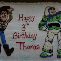 Buzz And Woody Buttercream icing. Traced images from colouring pages. Star tip #13 and number 2 and #1 tips used for outlines. It took some time but I...