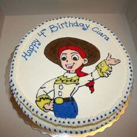 Jesse Toy Story 2 I was able to find a colouring page of Jesse and traced her on the cake. I used #13 Star tip and BC icing.