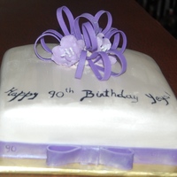 Yeya's 90Th Birthday Made this for a friend's grandmother's 90th Birthday. Covered in fondant with gumpate flower and bow.
