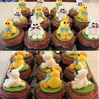 Easter Cupcakes Dark chocolate cupcakes with bavarian cream center, milk chocolate buttercream frosting and fondant critters.