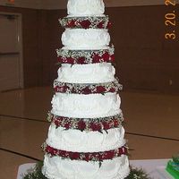 Tiered Roses This was my first wedding cake. I was very pleased with how it turned out. Every tier is a different flavor. The wedding party loved it too...