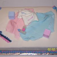 Twins Baby Shower This was my first baby shower cake, it was for twins a boy and a girl. Yellow cake, cream cheese icing, fondant covered, blue and pink...