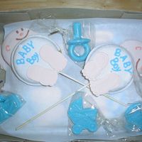 Baby Cookies On Sticks With Blue Candy Favors Used the Wilton recipe for Baby Shower Cookies and Icing. This was the toughest project I'd done and will never follow a Wilton recipe...