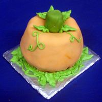 Mini Pumpkin Pumpkin made out of mini bundt pans. Covered with fondant and puttercream leaves. Cake is orange flavored with vanilla filling. I made a...