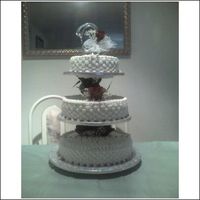 Swan Romance This wedding cake was for the daughter of my best friend. Carrot cake with fresh red roses.