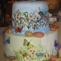 Butterflies This is chocolate with cherries, and white cake with almond and raspberries...fondant covered...purchased butterflies. From that amazing...