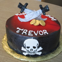 Pirate Birthday 10" pink lemonade cake with bavarian cream filling, buttercream icing and fondant decorations. Black was sprayed with a Prevail...