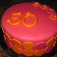 Beth's 50Th This is the first time I have ever made or even covered a cake in marshmallow fondant. Chocolate cake and fresh strawberry filling.