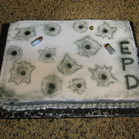 Bullets Pink lemonade cake with bavarian cream filling. This is the first time I have used a real airbrush. Bullets are fondant. Good thing it was...