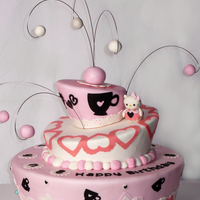 Hello Kitty Cake Whimsical Cake covered with MMF, Decoration (cricut cake) and gumpaste and Hello Kitty made out of gumpaste.Thanks for checking ; )