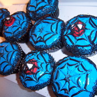 Spiderman Cupcakes made these to go with a superhero party! The spiderman are handmade with fondant and handpiped the webs!