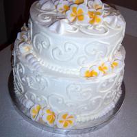 Plumeria Wedding Cake Lilikoi(passion fruit) chiffon cake with buttercream frosting and hand made fondant plumerias and seashells