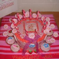 Strawberry Shortcake vanilla cake , with some parts tinted pink, so when you cut the cake you both receive yellow and pink vanilla cake, fun for childrenfondant...