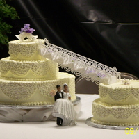 5 Tier Wedding Cake I ordered the cake topper and it was to heavy so I had to place it on the table to make it look as if they had just stepped off the stairs...