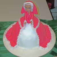 Christmas Doll I used the doll pan for this cake. Covered in fondant with buttercream "fringe."