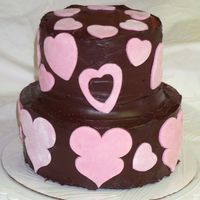 Chocolate Ganache Cake I used modeling chocolate tinted pink for the decorations. Inside torted layers are filled with meringue buttercream, which prevents the...