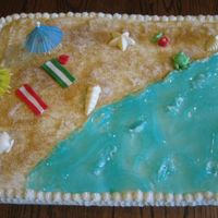 Beach Theme Buttercream icing w/ fondant. All edible except umberellas.