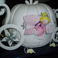 Cinderella's Carriage This is the William and Sanoma pumpkin bundt pan. The cake came out of Debbie Brown's Fairy Princess book. The cake is covered in...