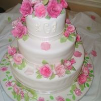 Leigh's Wedding Cake This is a 3 teired fondant covered wedding cake as a gift for my cousin. The roses are assorted soft pink to light mauve colores. They were...