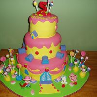Strawberry Shortcake This was for a 5 year olds birthday. This is out of the 2006 Wilton book. It is a 3 tiered fondant covered cake with the Wilton Strawberry...