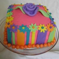 Fun Flower Cake Just playing around with fondant and learning how to do that fat fondant rose. It was fun!