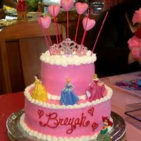 100_1617.jpg My daughter's 4th, she wanted princesses and pink. She loved it! Lemon/lemon-cream filling and white chocolate buttercream.