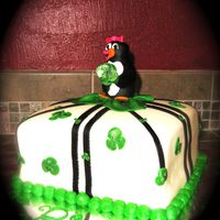 Penguins And Shamrocks! gumpaste/ fondant penguin, MMF. My friends daughter was born on St. Pat's day so she always has shamrocks somewhere on the cake,...