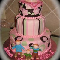 Welcome Baby Sister! Chocolate MMF, MMF, gumpaste/fondant baby, blanket, and big brothers. I gave the blanket a dusting of luster dust. I loved doing this cake...