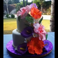 Hawaiian/tropical Theme This was my first attempt at gumpaste flowers besides small roses. I didn't have the petal molds so I made my own texture for the...