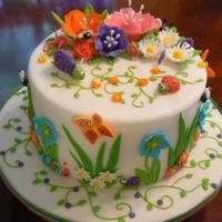 A Sweet Garden This was my first cake decorating class. White fondant base with gumpaste decorations.