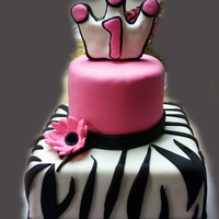 Happy First Birthday Haley!! For my friend's daughter's first birthday. All fondant and buttercream. the crown on top is made out of rice krispy treats,...