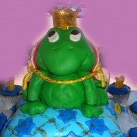 Logan's Frog Prince Birthday A pillow cake with a RKT frog, buttercream and fondant crowns with disco dust.