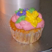Strawberry Cupcakes Strawberry cupcakes with royal icing flowers. The great thing about this cupcake is when you bite into it the center is filled with...