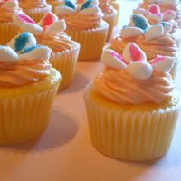 Orange Cupcakes Orange cream cheese mini cupcakes with marshmallow flowers.