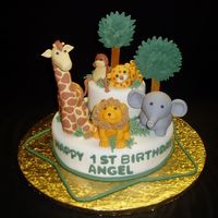 Safary I saw a similar cake in a website and just had to try it. All the animals are made of gumpaste and fondant mixed. It was tough getting the...