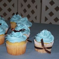 The Cupcakes For Blue And Brown Baby Shower cupcakes and ribbons