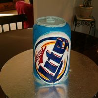 Hpim0472.jpg This was a cake that I made my Dad for his B-day. The Miller Light decal is made out of fondant and food coloring. I painted on the food...