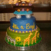Noah's Arc Baby Shower Cake I made this cake for my sisters baby shower. The cake topper is made out of chocolate and the animals are made out of fondant. The cake is...