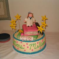 Hpim0528.jpg This was a cake that I had made for my sisters graduation party. All the decorations on top are made out of rice krispy treats and fondant...