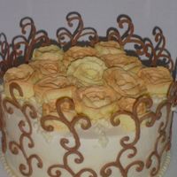 Swirly_Resized.jpg This was a birthday cake for a dear friend, Againg the picture does the cake no justice especially with the shadows cast by the chocolate...