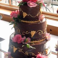 Heather's Wedding Cake This wedding reception was at a Winery, so the bride chose to have grapes designed on it. The cake is covered with chocolate bc and...