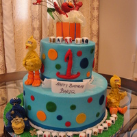 Sesame Street First Birthday Cake BC Icing,fondant gumpaste figures,sugar cubes,and plastic stars,cardboard box.WASC cake with cookie dough and cream buttercream :)
