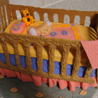 Baby Crib Cake Yummy Banana chip cake with chocolate ganache.All fondant decorations.my first time making a Teddy bear and a crib cake.