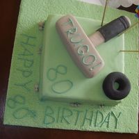 Trugo Cake I made this cake for my great uncle who play a very little known sport called Trugo, which involves hitting a rubber donut with a mullet.