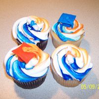U Of I Graduation Cupcakes These are some graduation cupcakes I made for someone who was graduating from the university of illinois. Orange and blue themed with caps...